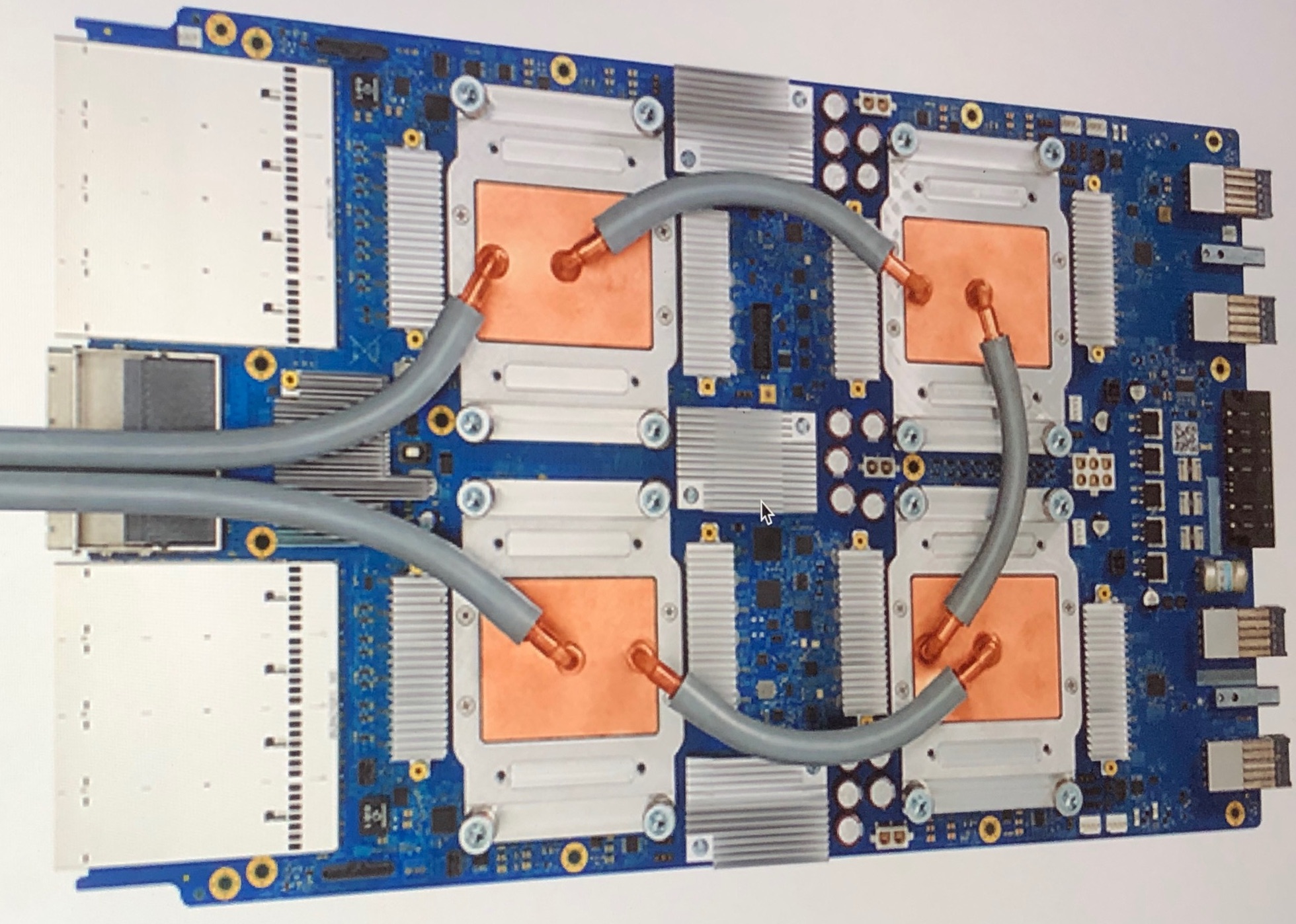 A TPU 3.0 board with four water-cooled Tensor Processing Units
